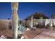 Beautifully landscaped backyard with desert plants and a seating area at 10951 E Mirasol Cir, Scottsdale, AZ 85255