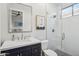 This lovely bathroom features a glass shower and a modern countertop and cabinets at 10951 E Mirasol Cir, Scottsdale, AZ 85255