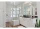 Modern bathroom with a glass-enclosed shower, tile walls, and a sleek vanity at 10951 E Mirasol Cir, Scottsdale, AZ 85255