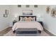 Comfortable bedroom featuring a plush bed with decorative pillows and bench, creating a relaxing retreat at 10951 E Mirasol Cir, Scottsdale, AZ 85255