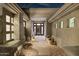 Welcoming entrance with a walkway leading to a modern front door, complemented by desert plants and lighting at 10951 E Mirasol Cir, Scottsdale, AZ 85255