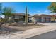 Desert home featuring native landscaping including a variety of mature cactus and desert plants at 10951 E Mirasol Cir, Scottsdale, AZ 85255