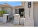 Inviting front entrance with unique design elements, courtyard, and desert landscaping at 10951 E Mirasol Cir, Scottsdale, AZ 85255