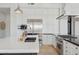 Gourmet kitchen featuring white cabinetry, stainless steel appliances, and a stylish central island at 10951 E Mirasol Cir, Scottsdale, AZ 85255