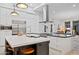 Bright kitchen boasts a large center island, stainless steel appliances, and an open design at 10951 E Mirasol Cir, Scottsdale, AZ 85255