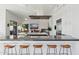 Modern kitchen featuring a center island with bar seating and state-of-the-art appliances at 10951 E Mirasol Cir, Scottsdale, AZ 85255