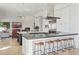 Spacious kitchen with a large island, stainless steel appliances, and an open view to the living area at 10951 E Mirasol Cir, Scottsdale, AZ 85255