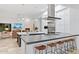 Modern, open-concept kitchen featuring a large island, stainless steel appliances, and views of the living space at 10951 E Mirasol Cir, Scottsdale, AZ 85255