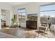Bright living room with desert views, hardwood floors, and modern decor at 10951 E Mirasol Cir, Scottsdale, AZ 85255