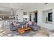 Comfortable living room showcasing plush seating and an open concept design with views of the kitchen at 10951 E Mirasol Cir, Scottsdale, AZ 85255