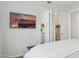 This main bedroom features a lovely television, a view of the closet, and a bright white interior at 10951 E Mirasol Cir, Scottsdale, AZ 85255
