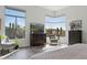 Bright main bedroom with large windows offering scenic views, complemented by stylish furnishings and decor at 10951 E Mirasol Cir, Scottsdale, AZ 85255