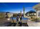 Outdoor patio area featuring lounge chairs, desert landscaping, and ambient lighting at 10951 E Mirasol Cir, Scottsdale, AZ 85255