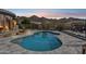 Outdoor pool area featuring desert landscaping and mountain views at 10951 E Mirasol Cir, Scottsdale, AZ 85255