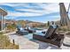Inviting backyard pool area with cushioned lounge chairs, desert landscaping, and scenic mountain views at 10951 E Mirasol Cir, Scottsdale, AZ 85255