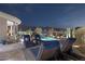 Beautiful pool area with lounge chairs and desert landscaping at twilight at 10951 E Mirasol Cir, Scottsdale, AZ 85255
