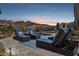 Relaxing pool area with lounge chairs and scenic mountain views, perfect for outdoor living at 10951 E Mirasol Cir, Scottsdale, AZ 85255