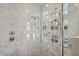Modern shower featuring dual shower heads and stylish glass block window at 10951 E Mirasol Cir, Scottsdale, AZ 85255