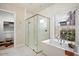 Bright bathroom showcasing a soaking tub, glass shower, and walk-in closet at 12315 E Black Rock Rd, Scottsdale, AZ 85255