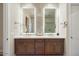 Modern bathroom with a double sink vanity, unique backsplash, and attractive lighting at 12315 E Black Rock Rd, Scottsdale, AZ 85255