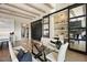 Dining area with glass table, view of a custom cabinet and office space, and access to the living room at 12315 E Black Rock Rd, Scottsdale, AZ 85255