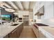 Contemporary kitchen featuring stainless steel appliances, a large island, and a sleek range hood at 12315 E Black Rock Rd, Scottsdale, AZ 85255