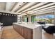 Open-concept island kitchen boasts ample counter space, modern appliances, and mountain views at 12315 E Black Rock Rd, Scottsdale, AZ 85255