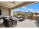 Outdoor living space with mountain views, comfortable seating, and modern grill area at 12315 E Black Rock Rd, Scottsdale, AZ 85255