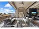 Expansive outdoor living space with comfortable seating, fireplace, tv and mountain view at 12315 E Black Rock Rd, Scottsdale, AZ 85255