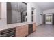 Features wine storage and prep area with granite countertops, adjacent to main living area at 12770 N 145Th Way, Scottsdale, AZ 85259