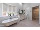 An elegant bathroom boasts a clawfoot tub, decorative tile accent wall, and a luxurious glass-enclosed shower at 12770 N 145Th Way, Scottsdale, AZ 85259