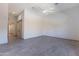 Large bedroom with a ceiling fan and access to another room via a sliding barn door at 12770 N 145Th Way, Scottsdale, AZ 85259