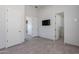 Bedroom with tile flooring, neutral paint, a television and access to the bathroom at 12770 N 145Th Way, Scottsdale, AZ 85259