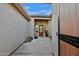 Inviting courtyard with desert plants, decorative front door and wall to provide privacy and curb appeal at 12770 N 145Th Way, Scottsdale, AZ 85259