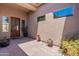 Welcoming private courtyard with multiple potted plants and natural light at 12770 N 145Th Way, Scottsdale, AZ 85259