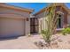 Attractive home featuring a stone facade, desert landscaping, and a private courtyard entry at 12770 N 145Th Way, Scottsdale, AZ 85259