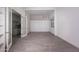 Large flex space featuring tile flooring, custom built-ins, and access to another room at 12770 N 145Th Way, Scottsdale, AZ 85259
