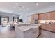 Well-lit kitchen with a large island, stainless steel appliances, and abundant cabinet space at 12770 N 145Th Way, Scottsdale, AZ 85259