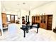 Bright living room with tile flooring and elegant furnishings including a grand piano at 12770 N 145Th Way, Scottsdale, AZ 85259