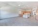 View of the open-concept living area and chef's kitchen with granite countertops and island at 12770 N 145Th Way, Scottsdale, AZ 85259