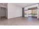 Open-concept living area with sliding glass doors leading to an outdoor pool and patio area at 12770 N 145Th Way, Scottsdale, AZ 85259