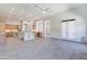 Spacious open-concept living area flowing into the chef's kitchen with island and wine storage at 12770 N 145Th Way, Scottsdale, AZ 85259