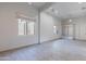Open living room features tiled floors, neutral walls, and lots of natural light at 12770 N 145Th Way, Scottsdale, AZ 85259