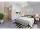 Serene main bedroom with neutral tones, a ceiling fan, and a sliding barn door for added character at 12770 N 145Th Way, Scottsdale, AZ 85259