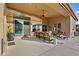 Spacious covered patio features ample seating, outdoor cooking area, and seamless indoor-outdoor living at 12770 N 145Th Way, Scottsdale, AZ 85259