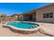Resort-style backyard featuring a pool with stone accents for elegant outdoor living at 12770 N 145Th Way, Scottsdale, AZ 85259