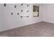Bright room featuring a window, stylish tile flooring, and unique decorative shelving at 12770 N 145Th Way, Scottsdale, AZ 85259