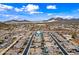 Scenic aerial view of a residential area, surrounded by desert terrain and majestic mountains at 1319 N Chatsworth St, Mesa, AZ 85207