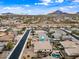Beautiful aerial view of a community with a pool and spa in some of the backyards plus desert mountain backdrop at 1319 N Chatsworth St, Mesa, AZ 85207