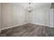 Spacious dining room with wood floors and modern chandelier at 1319 N Chatsworth St, Mesa, AZ 85207
